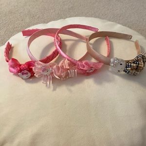 Lot of 4 Hello Kitty Girl’s Headbands. Qty 3 Pink. Qty 1 Tan.